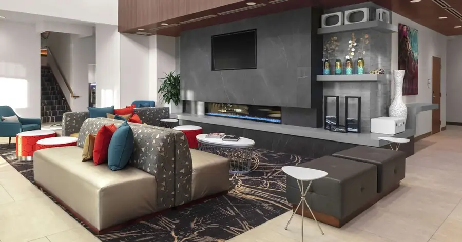 Hilton Garden Inn Denver Thornton lobby seating and fireplace