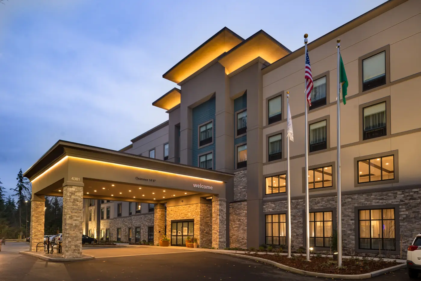 Welcoming hotel entrance at evening with warm exterior lighting